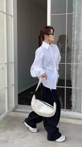 Minimalist white nylon crescent shoulder bag, casual dumpling crossbody bag for daily streetwear.