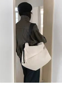 Large capacity canvas messenger bag for women, minimalist casual shoulder tote bag detail.