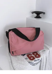 Pink oxford fabric casual shoulder bag detail, featuring wide black strap and large capacity.