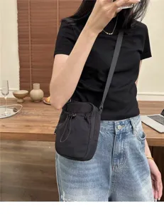 Japanese minimalist nylon crossbody bag for phone, lightweight casual shoulder bag for daily use.