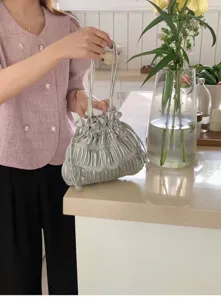 Metallic silver ruched drawstring shoulder handbag, trendy chic minimalist everyday crossbody bag.