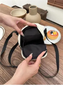 Japanese minimalist nylon phone crossbody bag interior detail showing compartments and strap.