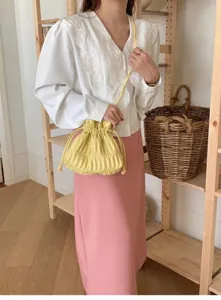 Trendy yellow pleated drawstring crossbody bag sweet style versatile shoulder handbag for women.
