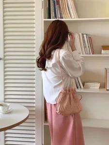 Chic pink ruched drawstring shoulder bag, stylish casual crossbody purse for women daily wear.