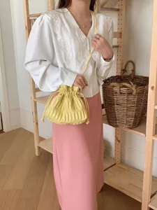 Trendy yellow pleated drawstring crossbody bag, versatile sweet shoulder pouch for women.