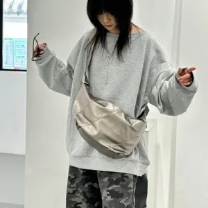 Metallic silver slouchy shoulder bag, soft leather crescent crossbody bag for daily commute.