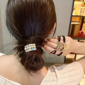 Detail view of fashionable elastic hair tie with sparkling rhinestones, elegant hair accessory.