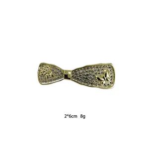 Gold rhinestone bow hair clip for women, stylish side hairpin and bang clip for elegant look.