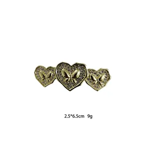 Gold rhinestone heart butterfly hair clip, elegant metal barrette for women daily styling.