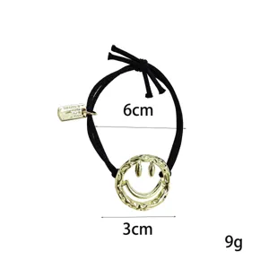 Fashion black hair tie with metal smiley pendant, high elasticity rubber band for daily wear.