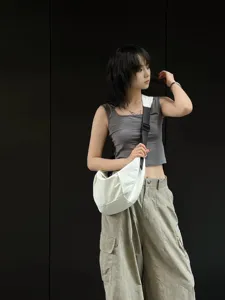 Casual large capacity white crescent canvas crossbody bag for women, stylish and practical.