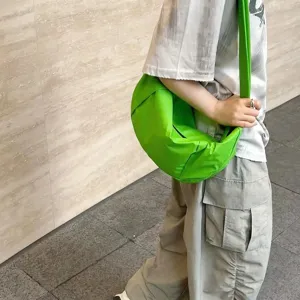 Green nylon crescent crossbody bag, casual large capacity dumpling shoulder bag for daily use.