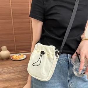 Japanese minimalist nylon crossbody phone bag for daily casual lightweight portable use.