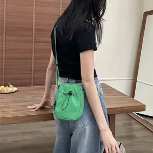 Minimalist nylon crossbody phone bag for daily casual wear, lightweight green shoulder bag.