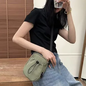 Minimalist nylon crossbody phone bag for men and women, casual lightweight shoulder bag.