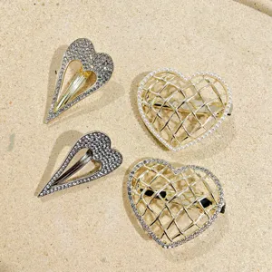 Heart hair clips set featuring dazzling rhinestones and elegant pearls for sweet styling.