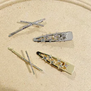 Set of 4 rhinestone hair clips, silver and gold cross and star metal duckbill side hairpins.