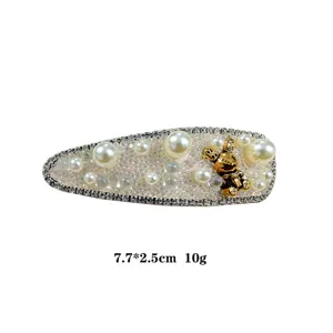 Elegant rhinestone pearl hair clip with cute gold bear charm, sweet accessory, 7.7x2.5cm.
