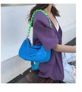 Chic canvas underarm shoulder bag with bright chain strap, trendy commuter handbag for women.