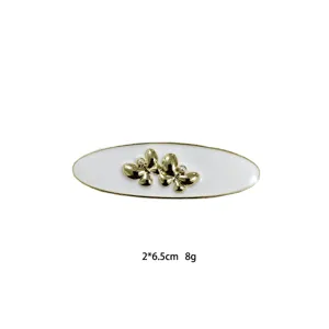 Elegant white oval hair clip with gold butterflies and pearls, compact design for daily wear.