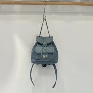 Quilted denim backpack with chain straps hanging display casual daily stylish mini bag