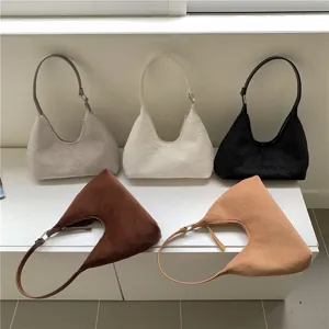 Fluffy plush hobo bag for women, cozy winter fuzzy crescent handbag with stylish strap design.