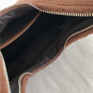 Brown fluffy underarm bag interior detail, soft plush hobo purse with secure zipper pocket.