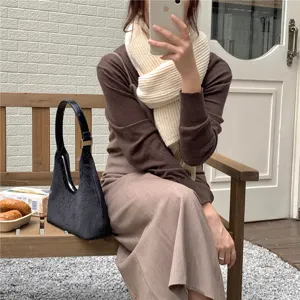 Chic black plush hobo shoulder bag for women, cozy fuzzy crescent design, trendy autumn winter accessory.