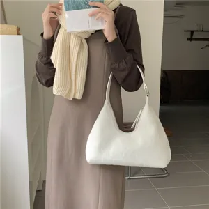 White plush hobo shoulder bag detailed view, soft furry crescent design for women.