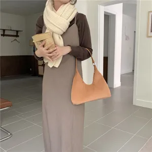 Stylish brown crescent underarm shoulder bag for women, elegant daily accessory detail view.