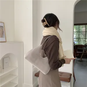 Detail view of stylish plush crescent shoulder bag in soft fuzzy material for women
