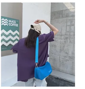 Detail shot of the stylish blue canvas shoulder bag, showing large capacity and comfortable strap.