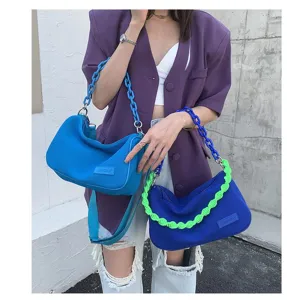 Detailed view of fashion underarm canvas shoulder bag with chunky chain strap for women.