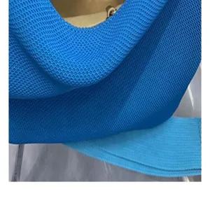 Blue knit shoulder bag detail, stylish woven texture, casual commuter handbag accessory.