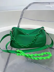 Green canvas underarm shoulder bag for women, stylish large capacity commuter handbag.