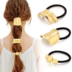 Close-up details of metallic gold hair ties and cuffs, perfect for stylish ponytail styling.