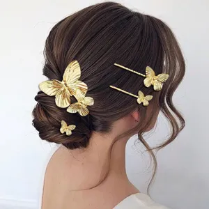 Gold butterfly hair clips detail showing elegant metal hairpins styling on updo hair.