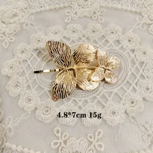 Golden butterfly hair clip elegant side hairpin shiny metal hair accessories for women.