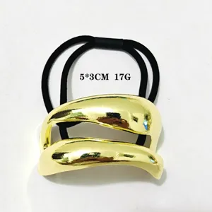 Minimalistisches goldenes geometrisches Haargummi mit schwarzem elastischen Band, schick.