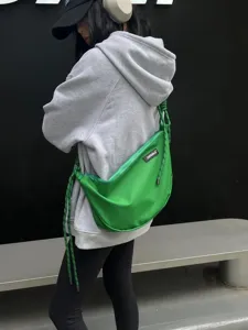 Green Oxford cloth crossbody dumpling bag with knot design, casual sports shoulder bag.