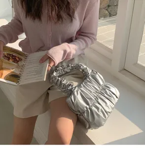 Stylish metallic silver ruched cloud handbag for women, soft versatile shoulder tote bag.