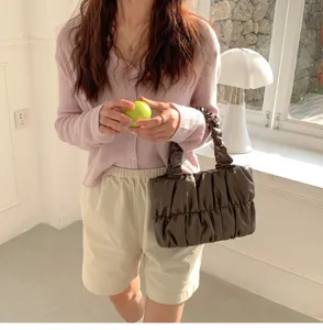 Stylish pleated brown cloud handbag for women, soft crossbody shoulder bag with chic design.
