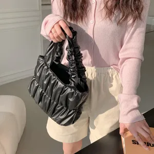 Stylish black faux leather gathered cloud handbag for women, soft slouchy tote and crossbody bag.
