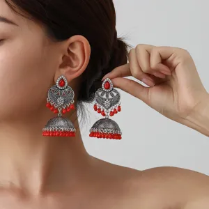 Indian ethnic bohemian carved long tassel earrings with red beads and gemstones for women.