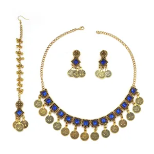 Bohemian gold-tone coin necklace set with blue cubic zirconia earrings and hair accessory.