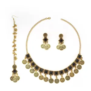 Detailed view of bohemian ethnic gold-tone choker necklace, earrings and headpiece set.