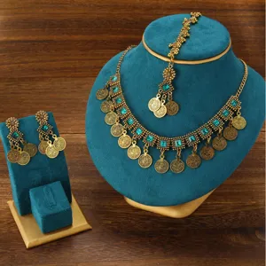 Bohemian ethnic vintage gold coin choker necklace earrings jewelry set detail view display.