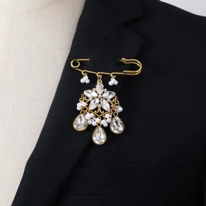 Vintage crystal pearl brooch pin, elegant gold tone safety pin jewelry for women detail shot