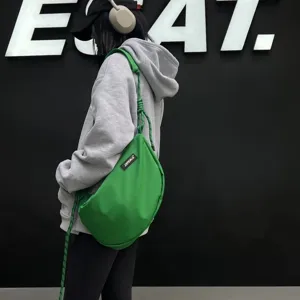 Green nylon dumpling shoulder bag with trendy knotted strap for women casual daily wear.