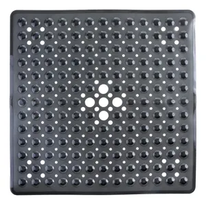 Close-up detail of black anti-slip bathroom mat showing dense suction cups and drainage holes.
